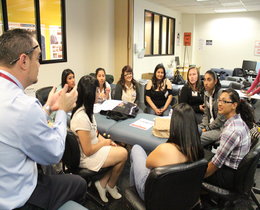 Students at orientation sitting and talking