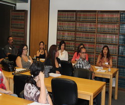 Students in library sitting at tables