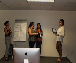 Students working in room with easel and paper